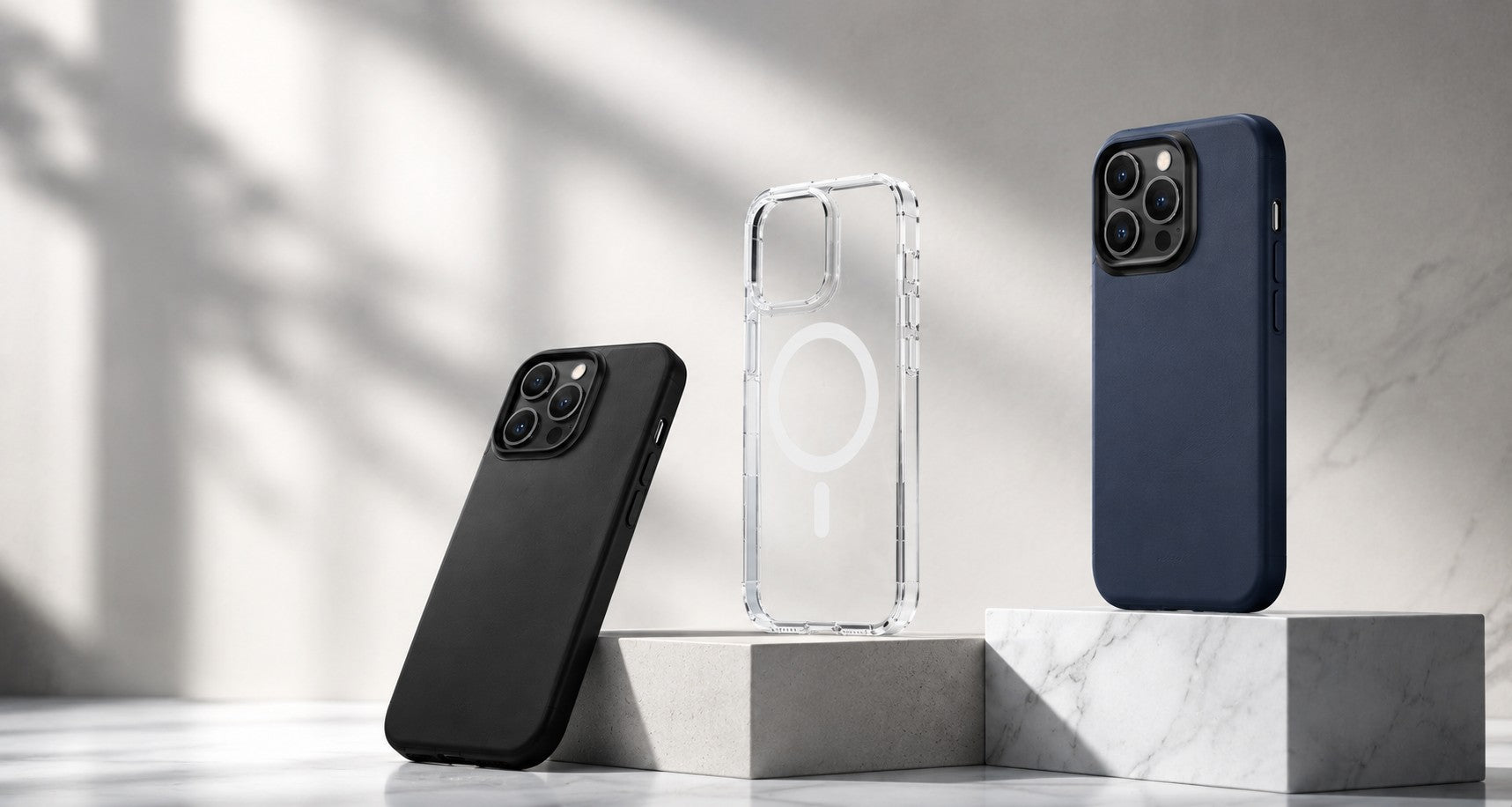 Phone cases on marble pedestals